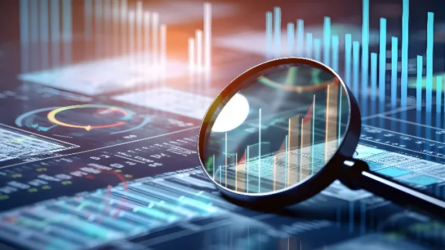graphs and magnifying glass